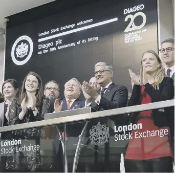  ??  ?? Staff and members of the leadership team open the market at the London Stock Exchange