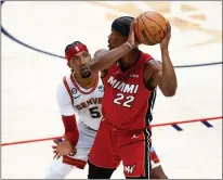  ?? Tribune News Service ?? Kentavious Caldwell-pope #5 of the Denver Nuggets defends against Jimmy Butler #22 of the Miami Heat during the first quarter in Game Five of the 2023 NBA Finals at Ball Arena on Monday.