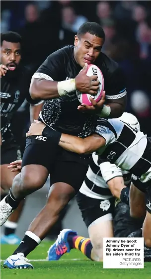  ?? PICTURES: Getty Images ?? Johnny be good: Johnny Dyer of Fiji drives over for his side’s third try