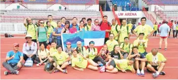  ??  ?? CLASS ABOVE: The state athletes pose at the end of the MIOMAC 2018 where Sabah collected 44 gold, 27 silver and 15 bronze medals at the UM Arena in Kuala Lumpur recently.