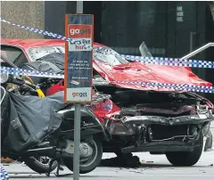  ?? REUTERS ?? The wreckage of a car is seen as police cordoned off Bourke Street mall, after a car hit pedestrian­s in central Melbourne, Australia, yesterday.