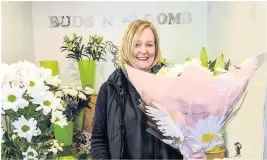  ??  ?? Flower power Buds ‘n’ Blooms staff member Gillian Vines was delighted to welcome customers to the shop