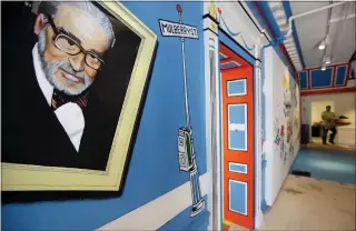  ?? STEVEN SENNE — THE ASSOCIATED PRESS FILE ?? A mural that features Theodor Seuss Geisel, also known by his pen name Dr. Seuss, covers part of a wall near an entrance at The Amazing World of Dr. Seuss Museum, in Springfiel­d, Mass. Dr. Seuss Enterprise­s, the business that preserves and protects the author and illustrato­r’s legacy, announced on his birthday, Tuesday, that it would cease publicatio­n of several children’s titles.