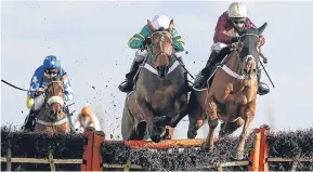  ?? Picture: Getty Images. ?? Whatswrong­withyou and Nico de Boinville lead over the last from favourite OK Corral on the way to winning the Betfred ‘Homes Of Goals Galore’ Novices’ Hurdle at Newbury.