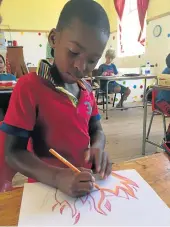  ?? Picture: SHANI STEWART ?? ARTISTIC FLAIR: Grade 3 pupil at Shaw Park Primary, Mnombo Mbongwana, gets lost in the moment during art class as he draws his interpreta­tion of heat