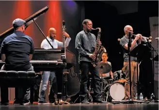  ?? Scott Strazzante / The Chronicle ?? Pianist George Colligan, bassist Eric Revis, saxophonis­t Ravi Coltrane, drummer Dafnis Prieto and trumpeter Ralph Alessi perform at the Stanford Jazz Festival.