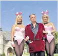 ??  ?? Hugh Hefner, with Playboy girls Sheila Level and Holly Madison, at the mansion