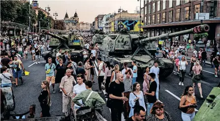  ?? AFP ?? PEOPLE look at destroyed Russian military equipment displayed in an open-air military museum in Khreshchat­yk street in Kyiv, as part of Ukraine’s Independen­ce Day celebratio­ns this week, amid Russia’s invasion of their country. |