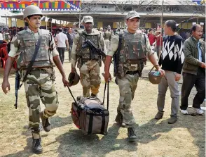  ?? — PTI ?? Security personnel leave for election duty on the eve of voting for the Assembly polls at Porompat in Imphal East on Friday.