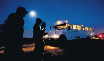  ??  ?? SEASONAL WORKERS holding H-2A visas head out before dawn to pick cauliflowe­r on a farm near Greenfield, Calif. Growers have to guess, as much as two months ahead of time, when they’ll need workers.