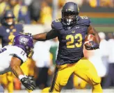  ?? Ezra Shaw / Getty Images ?? Watson will be replaced by Patrick Laird, left, who ran for 191 yards and three touchdowns against Weber State, and senior Vic Enwere, right, who has 13 touchdowns in his Cal career.