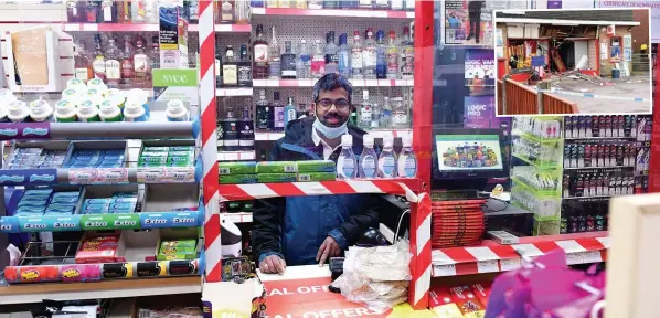  ?? Picture: Leanne Bagnall ?? REOPEN FOR BUSINESS: Pratheesh Shanmugana­than is back trading in his shop. Inset, the damage caused by the ram raid.