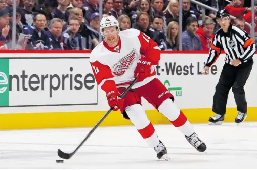  ?? Jonathan Kozub/nhLi via Getty imaGes fiLes ?? Daniel Alfredsson, sporting his Detroit Red Wings uniform during a recent game in Winnipeg, admits to mixed feelings about playing against the Senators this weekend. ‘I was there for so long, but then at the same time I now play for another team,’ he...