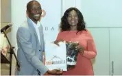  ??  ?? THULI Madonsela with Richard Mabaso, the founder of Imbumba Foundation which runs Trek4mande­laand Caring4gir­ls.