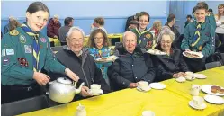  ?? Picture: Dougie Nicolson. ?? Scouts Lauren Mather, Ella Morenikeji, Keir Altoft and Archie Morris serve Peter Craig, Cameron Mackenzie and Ann Peebles.