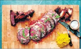  ?? Contribute­d by jennifer may ?? Chef Michael Symon recommends using the prime rib bones as the roasting rack and basting the meat with the rendered fat.