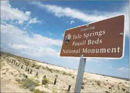  ?? Richard Brian ?? Las Vegas Review-journal @vegasphoto­graph A sign marks the boundary of the Tule Springs Fossil Beds National Monument.