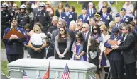  ?? Hearst Connecticu­t Media file photo ?? The family of Staff Sgt. Todd T.J. Lobraico Jr. stands by his coffin at a graveside ceremony at North Cemetery in Sherman on Sept. 13, 2013.