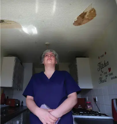  ??  ?? Angela McCabe’s flat has been left scarred by repeated flooding incidents