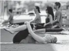  ?? Staff file photo ?? Flow Yoga class at Discovery Green