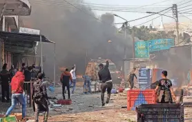  ?? ZAIN JAAFAR/AFP VIA GETTY IMAGES ?? Palestinia­ns clash with Israeli security forces during a raid in the occupied West Bank city of Nablus on Wednesday. The Israeli military said it entered the city to arrest three wanted militants suspected in previous shooting attacks.