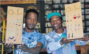  ?? Picture: Simphiwe Nkwali ?? Thapelo Tebele, left, and Collens Mohlaba with some of their jewellery.