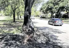  ?? Yi-Chin Lee / Staff photograph­er ?? Auto parts are spilled over the median after a driver crashed into a tree and the car caught fire in the impact in Westbury.