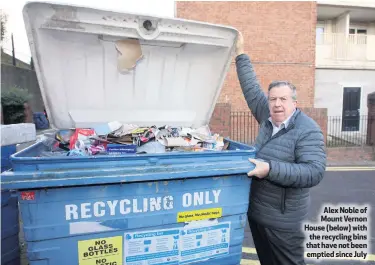  ??  ?? Alex Noble of Mount Vernon House (below) with the recycling bins that have not been emptied since July