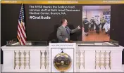  ?? NEW YORK STOCK EXCHANGE ?? In this image taken from video, Tommy Gannon, assistant supervisor, facilities, rings the opening bell at the New York Stock Exchange and recognizes the Sodexo food services staff at Beth Israel Deaconess Medical Center in Boston.