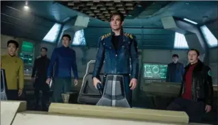  ?? KIMBERLEY FRENCH, PARAMOUNT PICTURES ?? These are some of the voyagers on the Starship Enterprise: John Cho plays Sulu, Anton Yelchin plays Chekov, Karl Urban plays Bones, Chris Pine plays Kirk, Zachary Quinto plays Spock and Simon Pegg plays Scotty.