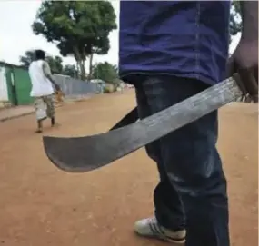  ?? ?? Terror gangs use machetes on their victims