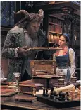  ??  ?? The Beast (Dan Stevens) and Belle (Emma Watson) in the castle library