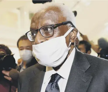  ??  ?? 0 EX-IAAF president Lamine Diack wears a protective mask as he arrives at court in Paris for his trial.