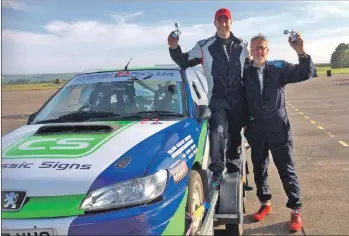  ??  ?? John MacDonald and Chris Wareham with their trophies from the recent Granites Rally, in which they finished 18th overall.