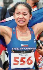  ?? — Bernama ?? Tears of joy: abal Mary Joy Reyes celebratin­g after winning the women’s marathon in Putrajaya yesterday.