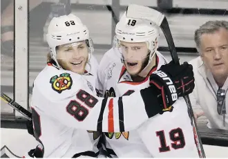  ?? Charles Krupa/The Associated Press ?? Chicago Blackhawks Patrick Kane, left, and Jonathan Toews celebrate a goal during the NHL playoffs. The Hawks have announced eight-year contract extensions worth $84M for each player.