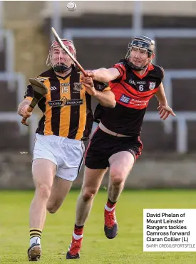  ?? BARRY CREGG/SPORTSFILE ?? David Phelan of Mount Leinster Rangers tackles Camross forward Ciaran Collier (L)