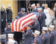  ?? FRANK ELTMAN/ASSOCIATED PRESS ?? The flag-draped casket of New York Fire Department Battalion Chief Lawrence Stack is carried Friday from his funeral in St. James, N.Y.