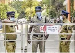  ?? — PTI ?? Security personnel wear protective masks in wake of the deadly novel coronaviru­s at Government Gandhi Hospital in Hyderabad on Tuesday.