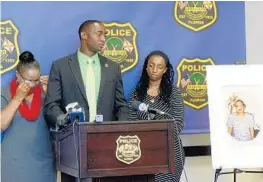  ?? TAIMY ALVAREZ/STAFF PHOTOGRAPH­ER ?? From left, Marie Carline Laverne, Joshua Pierre and Carla Joseph ask for help in solving the 20-year-old unsolved murders of their family members.