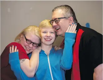  ?? LEAH HENNEL ?? Mom Kristy, left, and stepdad Phil Bacon, right, said hearing son Drew Shepherd laugh again is the “most beautiful thing” after he struggled to cope with his mom’s cancer diagnosis and the death of his father.