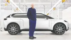  ?? DYSON ?? James Dyson displays the now-cancelled electric car he had planned to build.