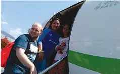  ?? Holt family photo via AP ?? ■ In this image provided by the Holt family, Joshua Holt, his wife, Thamara, and her daughter board a plane Saturday at the airport in Caracas, Venezuela.