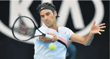  ?? Picture: AFP /PETER PARKS ?? SUPER SWISS: Switzerlan­d’s Roger Federer hits a return against Slovenia’s Aljaz Bedene during their singles first-round match on day two of the Australian Open in Melbourne yesterday