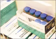  ?? Seth Wenig / Associated Press ?? Measles, mumps and rubella vaccines sit in a cooler.