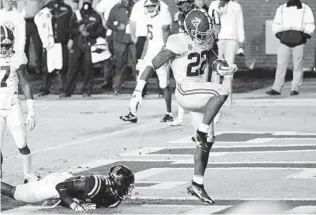  ?? ROGELIO V. SOLIS AP ?? Alabama’s Najee Harris, who rushed for 206 yards and five TDS, dances into the end zone.