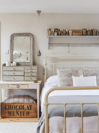  ??  ?? MASTER BEDROOM ‘Our bedroom is a very calm haven,’ says Natalie. ‘The apothecary cupboard is one of my most treasured pieces.’
Apothecary cupboard (below), £895; jars, £40 each, all Hill & Co Home. Oliver bed, from £400, Feather & Black. Shelf, £220; table, £245, both Haus. Crate, £120, Three Angels. Postes France cushions, £75 each, The Country Brocante. Lassi cups, £30 each, Pillo. Chair, £80, Lots Road Auctions