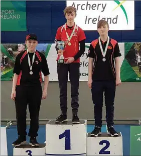  ??  ?? Brandon Dollard (left) collects his bronze medal for Cuchulainn Archers.