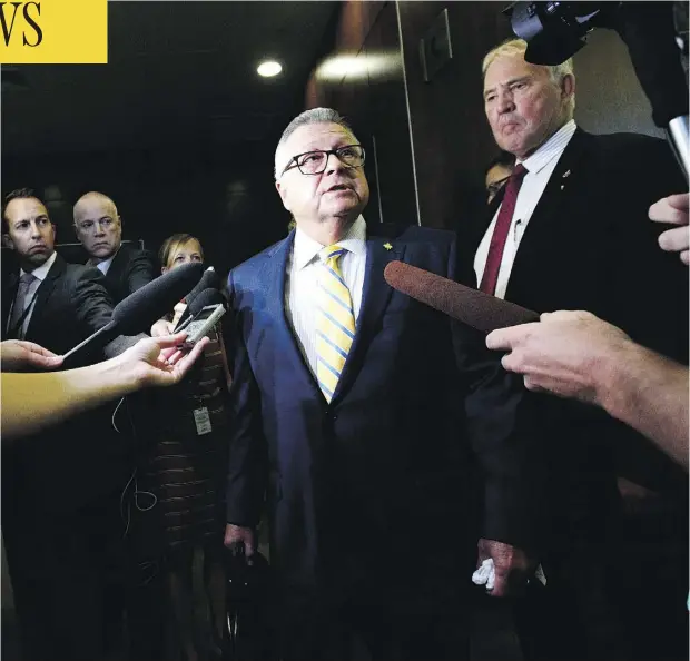  ?? THE CANADIAN PRESS/SEAN KILPATRICK ?? Public Safety Minister Ralph Goodale, left, and Minister of Border Security Bill Blair speak to the media before attending an emergency House of Commons immigratio­n committee meeting to discuss the issue of asylum seekers crossing the Canadian border.