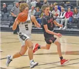  ?? ?? Silverdale senior Connor Delashmitt drives against Signal Mountain’s Andrew Matukewicz during Tuesday’s season opener at the Silverdale Center.